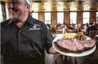  ?? Houston Chronicle file ?? Some fattier cuts of beef, such as the prime rib at Killen’s BBQ, lend themselves to smoking.