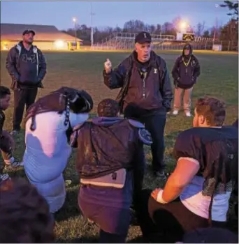  ?? RICK KAUFFMAN — DIGITAL FIRST MEDIA ?? Interboro coach Steve Lennox, center, speaks to his team following practice Tuesday as the Bucs approach the big game Thursday against Ridley High School.