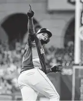  ?? Yi-Chin Lee / Staff photograph­er ?? Catcher Martín Maldonado celebrates his solo home run during the bottom of the third inning Sunday.