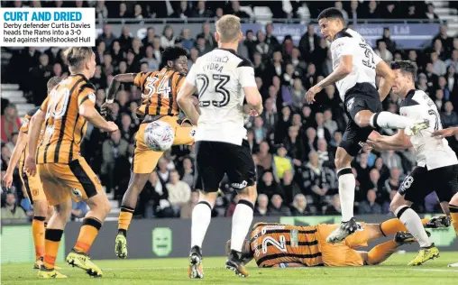  ??  ?? CURT AND DRIED Derby defender Curtis Davies heads the Rams into a 3-0 lead against shellshock­ed Hull