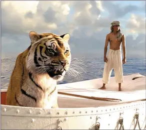  ??  ?? Suraj Sharma (pi) and his feline friend share a boat in the dramatic LifeofPi (Saturday, Channel 4, 6.55p.m.)