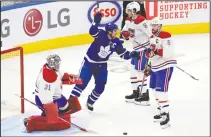  ?? CP PHOTO FRANK GUNN ?? Toronto Maple Leafs’ John Tavares (91) celebrates after scoring on Montreal Canadiens goaltender Carey Price (31) during first period NHL hockey action in Toronto, Wednesday.