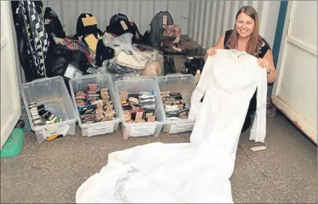  ?? Picture: John Stevenson. ?? PC Fiona McDougall with some of the unclaimed items from T in the Park — including a wedding dress.