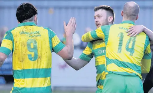  ?? James Eastup ?? Runcorn Linnets marksman Kris Holt ( centre) celebrates with teammate Freddie Potter ( left) last Saturday’s 5-1 victory over AFC Darwen at the Millbank Linnets Stadium. and Stuart Wellstead during