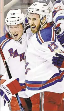  ?? AP ?? Kevin Hayes (r.) celebrates with J.T. Miller after scoring game-winner for Rangers against Winnipeg Thursday.