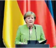  ??  ?? Angela Merkel speaking yesterday in Berlin to mark World Refugee Day