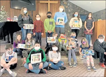  ?? Pennie Wredberg / Courtesy photo ?? Students at Lighthouse SDA Christian School with some of the "birthday boxes" that they created.