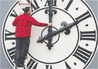  ?? SEBASTIAN KaHNERT/GETTY IMAGES FILES ?? Many experts are challengin­g the wisdom of changing our clocks twice a year, with some arguing that the original intent of the practice — energy savings — is unfounded.