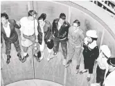  ??  ?? Riders took in the new centrifuga­l ride at the 1958 Stampede midway.