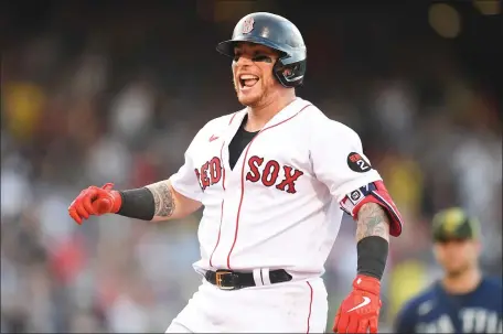  ?? GETTY IMAGES ?? CLUTCH HIT: Christian Vazquez reacts after hitting a go-ahead RBI single in the eighth inning against the Seattle Mariners at Fenway Park on Saturday.