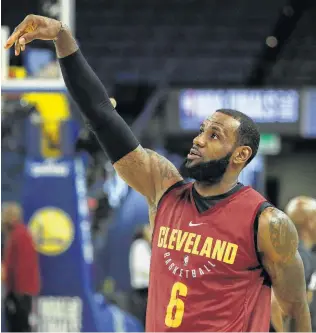  ?? Marcio Jose Sanchez / Associated Press ?? Can LeBron James will the Cavaliers to their second NBA championsh­ip in three years? One Express-News sportswrit­er says the King and his court will prevail in seven games.