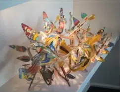  ??  ?? A sculpture of feathers and flowers by Seattle artist Ginny Ruffner. “Everything I own, I bought for a reason — a memory,” Ainsley says. “I lived in a traditiona­l home. I was born in Toronto and grew up in Preston, between Guelph and Kitchener. My best...