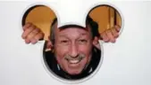  ??  ?? Circa 1980 Roy Disney in Toronto at Walt Disney Studio: “I couldn’t resist asking Roy Disney, Walt’s nephew, to stick his head through the Mickey Mouse cut-out in the door. Scary how much he looks like Walt.”