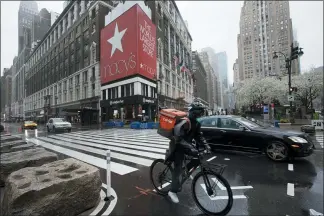  ?? MARK LENNIHAN — THE ASSOCIATED PRESS ?? Traffic is light Monday outside Macy’s in Herald Square in New York. Macy’s stores nationwide are closed due to the coronaviru­s.