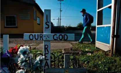  ?? America. Photograph: Brendan Smialowski/AFP/Getty Images ?? A memorial in Huntington, West Virginia. Communitie­s have been devastated by the opioid crisis, including in many parts of rural