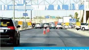  ??  ?? KUWAIT: Police man a checkpoint on Fahaheel Expressway on May 30, 2020, one day before the total curfew was eased and three areas - Hawally, Farwaniya and Khaitan joined Jleeb Al-Shuyoukh and Mahboula under total lockdown. —Photos by Fouad Al-Shaikh