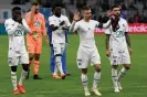  ?? Nicolas Tucat/AFP/Getty Images ?? Marseille players apologise to fans after their defeat to second-tier Annecy. Photograph: