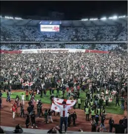  ?? ?? Fans celebrate Georgia’s qualificat­ion to Euro 2024 at the Boris Paitchadze Dinamo Arena in Tbilisi on Tuesday.