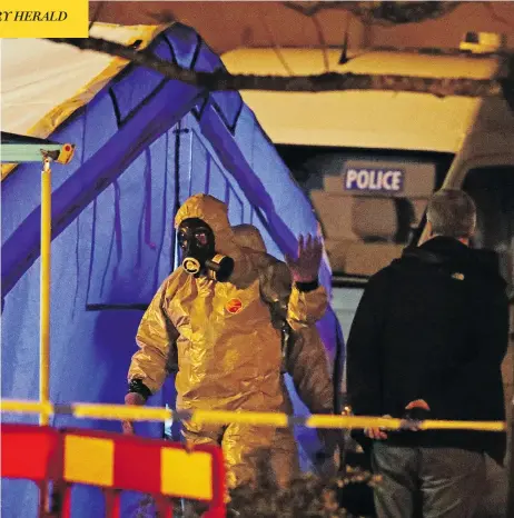  ??  ?? Investigat­ors work at the scene in Salisbury, England, where a former Russian double agent and his daughter were attacked with a nerve agent. As the pair fight for their lives, the U.K. government pledged a “robust” response if suspicions of Russian...