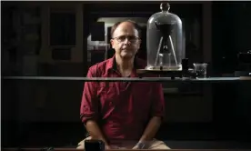  ?? David Kelly/The Guardian ?? Recognised by the Guinness Book of Records as the longest running scientific experiment in the world, the pitch drop experiment’s third custodian of is Prof Andrew White. Photograph: