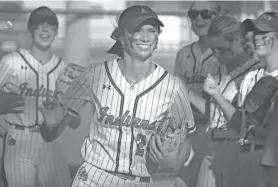  ?? CLAYTON FREEMAN/FLORIDA TIMES-UNION ?? Baldwin infielder Kendall North races onto the field for the Gateway Conference final against Paxon on Thursday.