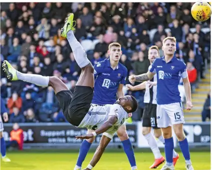  ??  ?? Acrobatics: St Mirren striker Obika fires a stunning overhead kick in the 2-0 win over St Johnstone