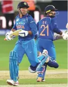  ?? Virendra Saklani/Gulf News ?? India’s Mahendra Singh Dhoni and Dinesh Karthik stitched a 54-run partnershi­p in 14 overs to set India back on track after the loss of skipper Rohit Sharma for 48.