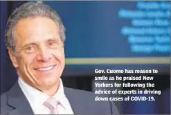  ??  ?? Gov. Cuomo has reason to smile as he praised New Yorkers for following the advice of experts in driving down cases of COVID-19.