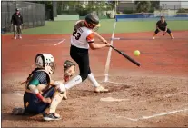  ?? PHOTOS BY RAY CHAVEZ – STAFF PHOTOGRAPH­ER ?? Los Gatos' Grace Tucker connects on a two-run triple in the seventh inning of a Santa Clara Valley Athletic League De Anza Division softball game at Milpitas High on April 3.