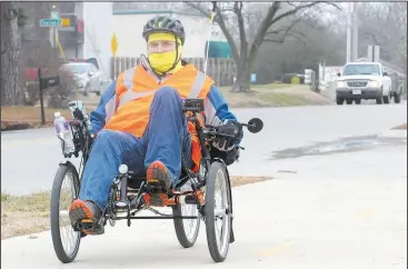 ?? NWA Democrat-Gazette/DAVID GOTTSCHALK ?? Jason McCrory rides Tuesday on the Powell Street section of the Razorback Greenway in Springdale. McCrory started in Centerton and was heading to Fayettevil­le for lunch and then returning to Centerton on the recumbent tricycle. Representa­tives of Toole Design gave Springdale planners a presentati­on Tuesday night of their draft report for a transporta­tion system that includes pedestrian­s, cyclists and motorists.