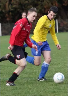  ??  ?? Seán ‘Mini’ Ryan, who scored a double for St. Leonards, in a race for possession with Ryan Donnelly of Curracloe United.