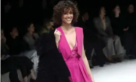  ?? Photograph: Matteo Bazzi/EPA ?? A smiling model in a creation by Italian label Armani at Milan fashion week in February 2023.