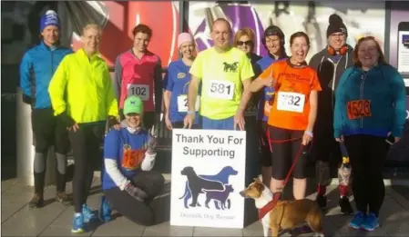  ??  ?? Fundraiser­s for Dundalk Dog Rescue take part in the Dundalk 10k earlier this year