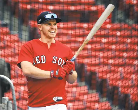  ?? Elise Amendola / Associated Press ?? The Red Sox’s Brock Holt holds a bat at a workout Thursday in Boston.