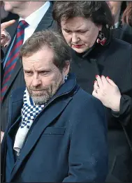  ??  ?? Kelly’s sons Emmet and Stephen carry coffin; right, actor Ardal O’Hanlon, who starred alongside Kelly in Father Ted, at the funeral yesterday