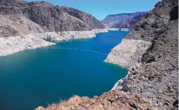  ?? ROSS D. FRANKLIN/ASSOCIATED PRESS ?? The low level of the water line is shown on the banks of the Colorado River in Hoover Dam, Ariz., in May. The Southwest is struggling with an unpreceden­ted drought.