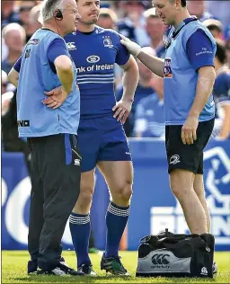  ??  ?? final act: Brian O’Driscoll receives treatment during his final game