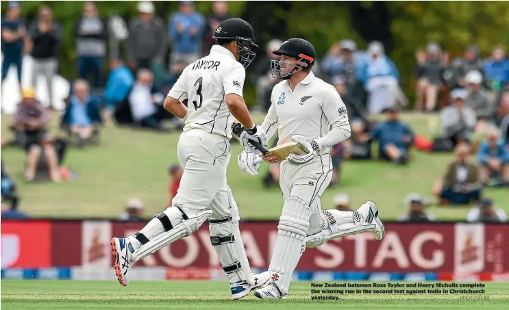 ?? PHOTOSPORT ?? New Zealand batsmen Ross Taylor and Henry Nicholls complete the winning run in the second test against India in Christchur­ch yesterday.