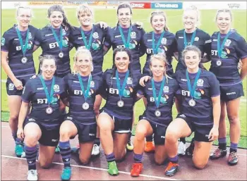  ?? Report: Scottish Rugby ?? Oban’s Abi Evans, front row centre, and Glencoe’s Helen Nelson, front row right, with their Scotland team mates after qualifying for the Rugby Europe Grand Prix.