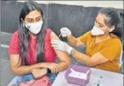  ?? HT FILE ?? A woman gets inoculated against Covid-19, in Amritsar.