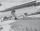  ?? DAVID CRIGGER/AP ?? Workers turn Bristol Motor Speedway into a dirt track on Jan. 14 in Bristol, Tenn. Bristol will host NASCAR’s first Cup race on dirt in 70 years on Sunday.