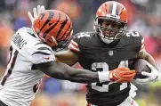  ?? NICK CAMMETT / ASSOCIATED PRESS ?? Nick Chubb tries to break free from Bengals defensive back Michael Thomas on Jan. 9 in Cleveland. The Browns host Cincinnati on Oct. 31 for “Monday Night Football.”