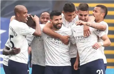  ??  ?? Manchester City players in joyous mood as they prepare to win third league title in four years
