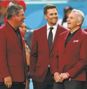  ?? Jamie Squire / Getty Images ?? Quarterbac­ks Dan Marino (left), Tom Brady and Joe Montana were among those honored as part of the NFL 100 AllTime team before the game.