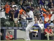  ?? MORRY GASH – THE ASSOCIATED PRESS ?? Yordan Alvarez of the Astros is fired up after hittng his second homer of the game, a grand slam in the sixth inning.