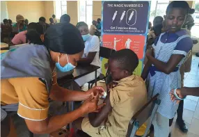  ?? — Picture: Tinai Nyadzayo ?? Pupils at Sekuru Sunday Primary School in Hobhouse, Mutare, receive Covid-19 vaccines on Tuesday. The Ministry says parents and caregivers should encourage and allow children from 12 years upwards to get vaccinated against the virus.