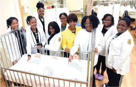  ?? (Special to The Commercial/University of Arkansas at Pine Bluff) ?? Nursing students and staff are shown in the simulation lab. From left: Elyssa Kennedy, Taylor Qualls, LaMarques Woodard, Dakedra Holmes, Madison Powell, Department Chair Diann Williams, Niveah Lowery, Shakirah Brown and Kylie Norman.