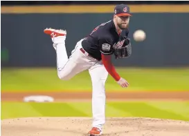  ?? ELSA GARRISON/ASSOCIATED PRESS ?? Cleveland Indians starting pitcher Corey Kluber throws during the first inning of Tuesday’s Game 1 of the World Series against the Chicago Cubs. Kluber pitched six innings of four-hit ball, with nine strikeouts, as the Indians shut out the Cubs.