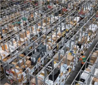  ??  ?? A staff member processes goods at an overseas warehouse of Cainiao, the logistics arm of e-commerce giant Alibaba, in Guadalajar­a, Spain, on November 11