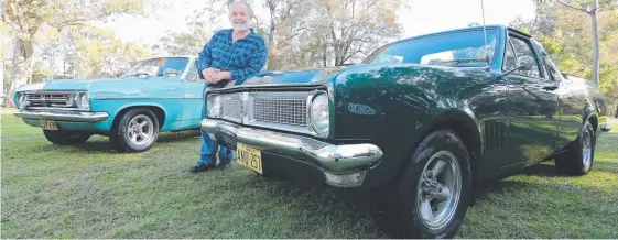  ?? Picture: RICHARD GOSLING ?? John Russell is used to getting “a wave and thumbs up” from passers-by when he’s out in his his 1970-71 HG ute and 1966-67 HR Holden.